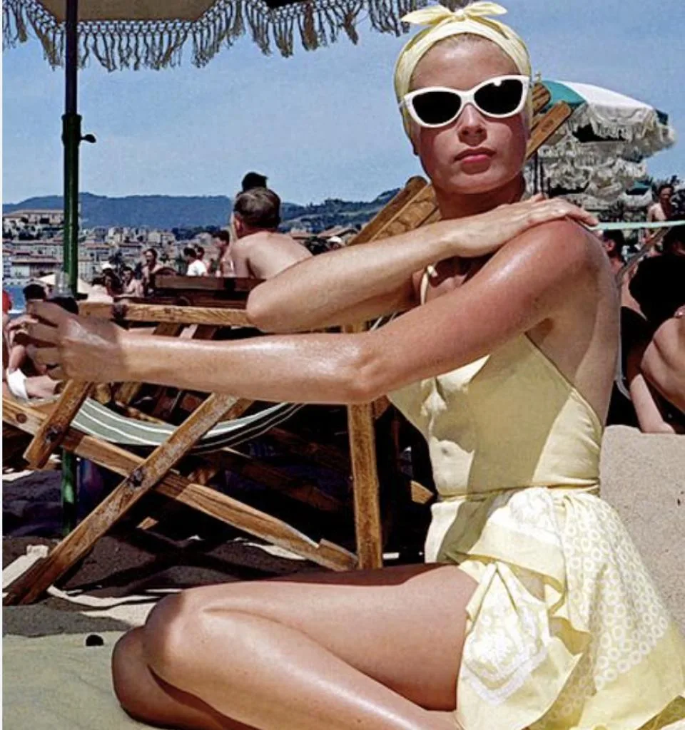 Image of Grace Kelly wearing a yellow swimsuit in To Catch a Thief