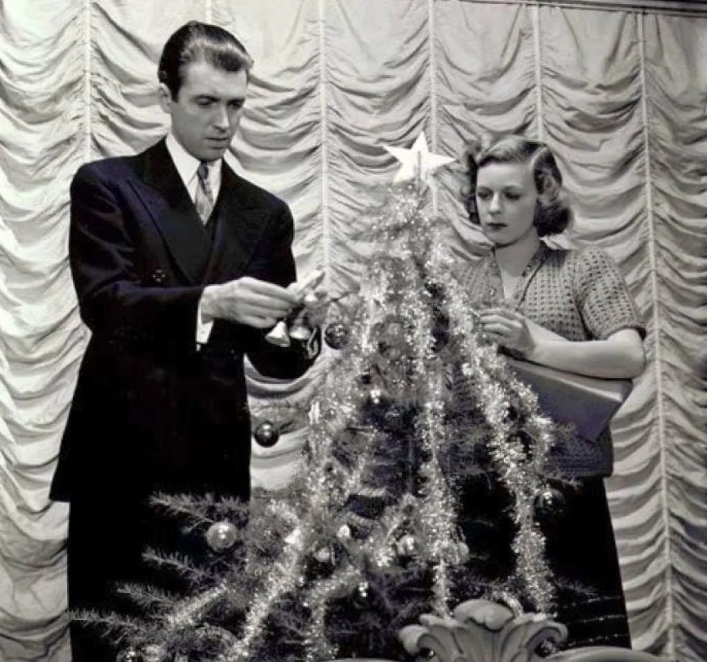 Image of James Stewart and Margaret Sullivan decorating a Christmas Tree in "The Shop Around the Corner."