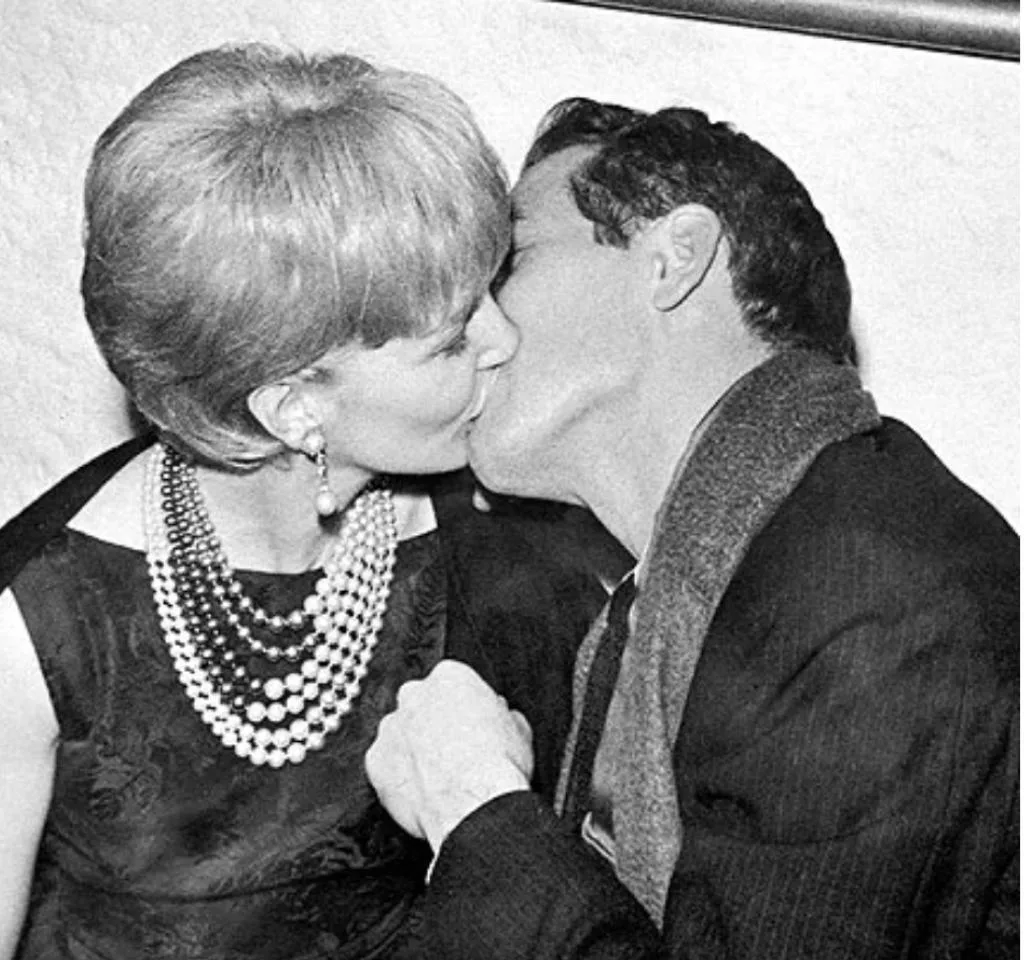 Image of Paul Newman and Joanne Woodward kissing on New Years Eve, 1961